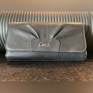 Coach black checkbook wallet.